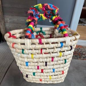 Confetti colored straw tote. Handles covered in multicolored thread.